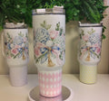 Tumbler with a floral golf motif